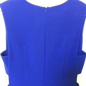 Clove Blue Dress with tasteful cut-outs at ribs.